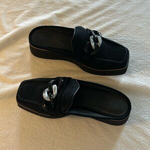 Black suede platforms with tortoise buckle.  2 3/4 inch heel height. Size 9.